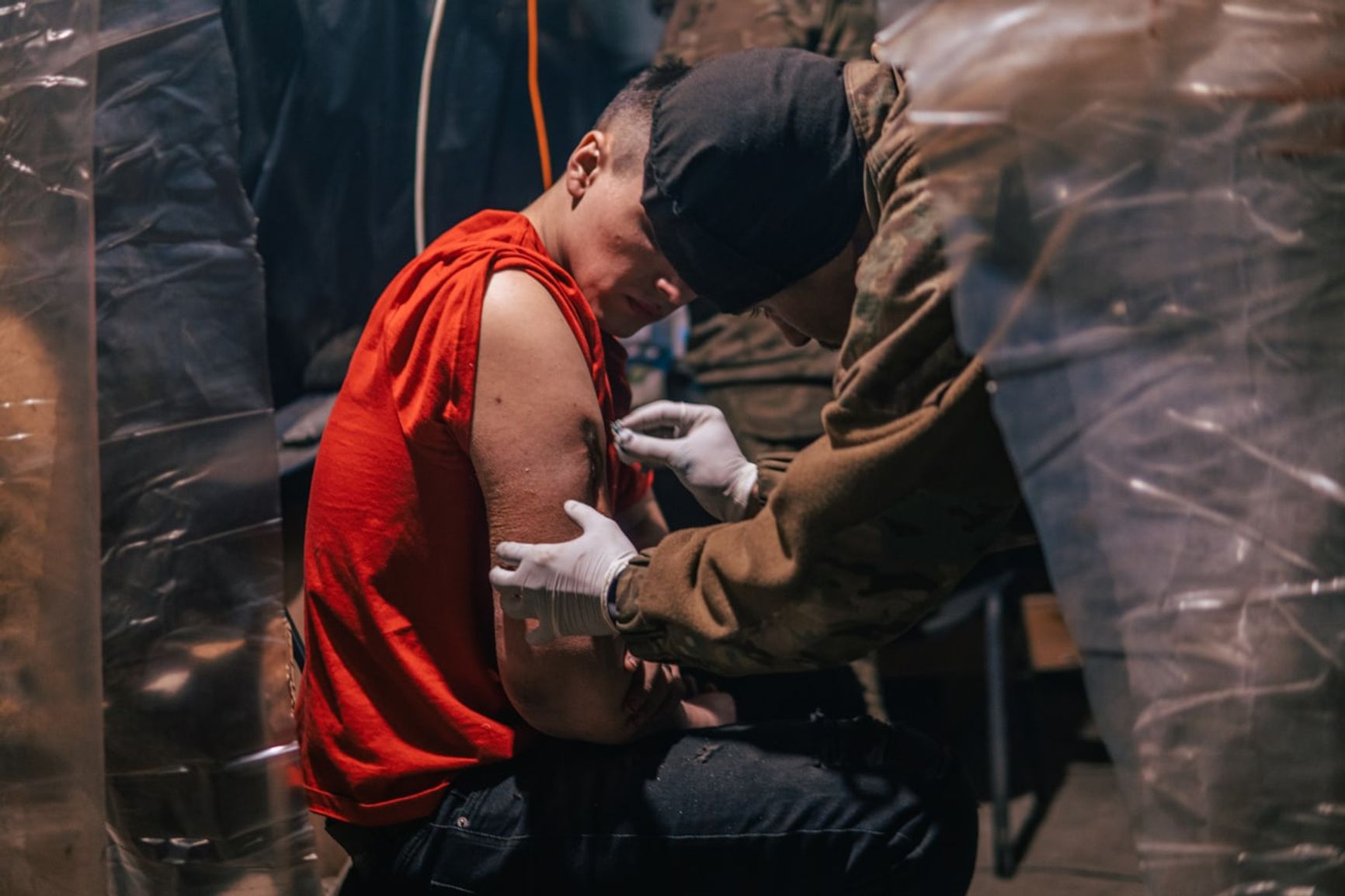 A medic helping an Azovstal defender